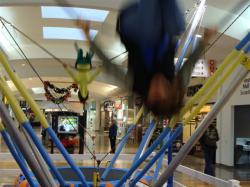 Alison and Atleigh on trampolines in mall